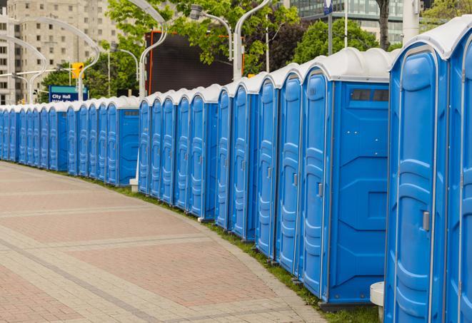 a line of brightly-colored portable restrooms, perfect for outdoor festivals and concerts in Aurora